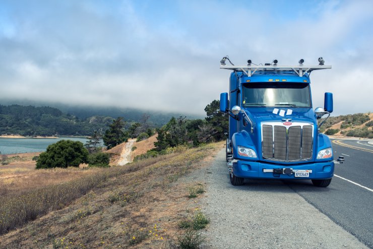 blue truck on scenic highway
